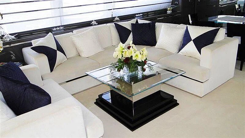 a living room with a white couch and a coffee table aboard PRATA DO LYS Yacht for Sale