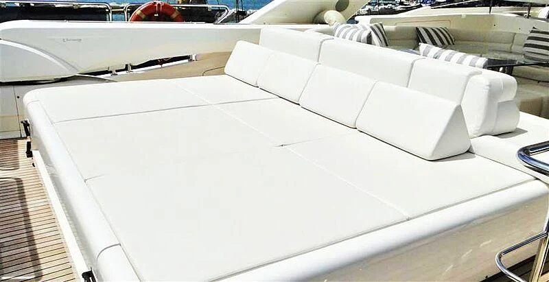 a white laptop on a table aboard PRATA DO LYS Yacht for Sale