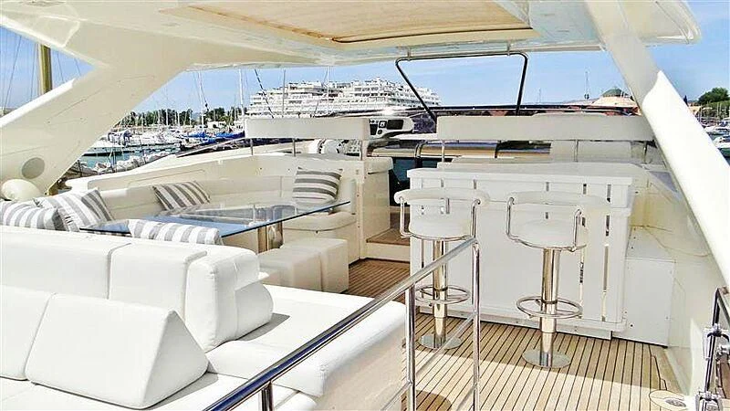 a large yacht with a large white deck and a large white table aboard PRATA DO LYS Yacht for Sale