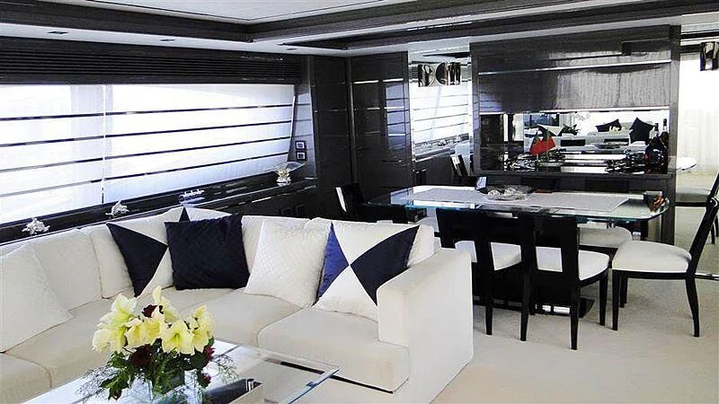 a room with a couch and a table and chairs aboard PRATA DO LYS Yacht for Sale