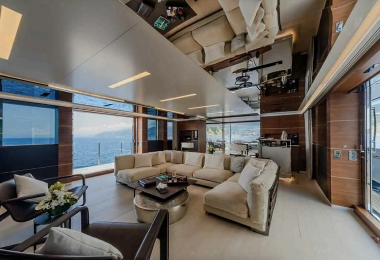 a living room with a large window aboard LADY A Yacht for Sale