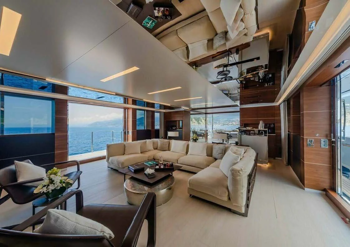 a living room with a large window aboard LADY A Yacht for Sale