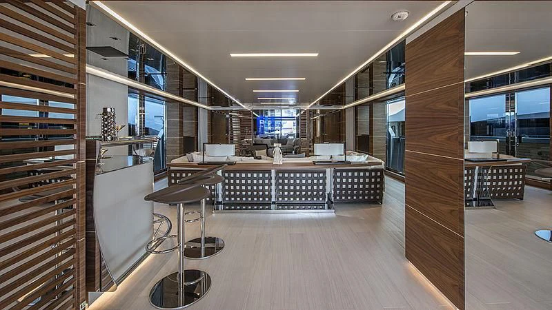 a room with a table and chairs aboard LADY A Yacht for Sale