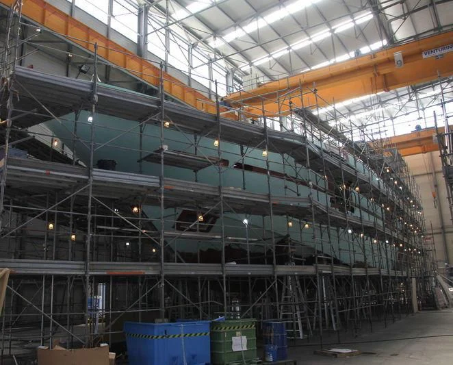 a large warehouse with many racks of goods aboard LADY A Yacht for Sale