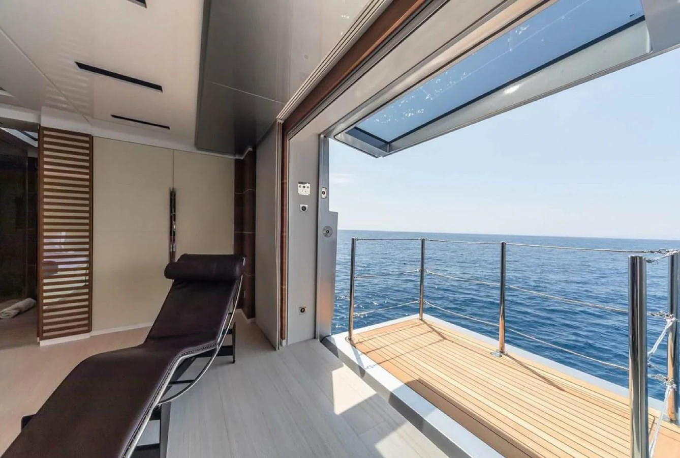 a deck with a view of the ocean and the deck aboard LADY A Yacht for Sale