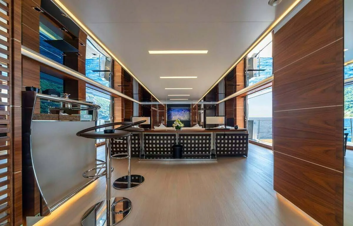 a room with a table and chairs aboard LADY A Yacht for Sale
