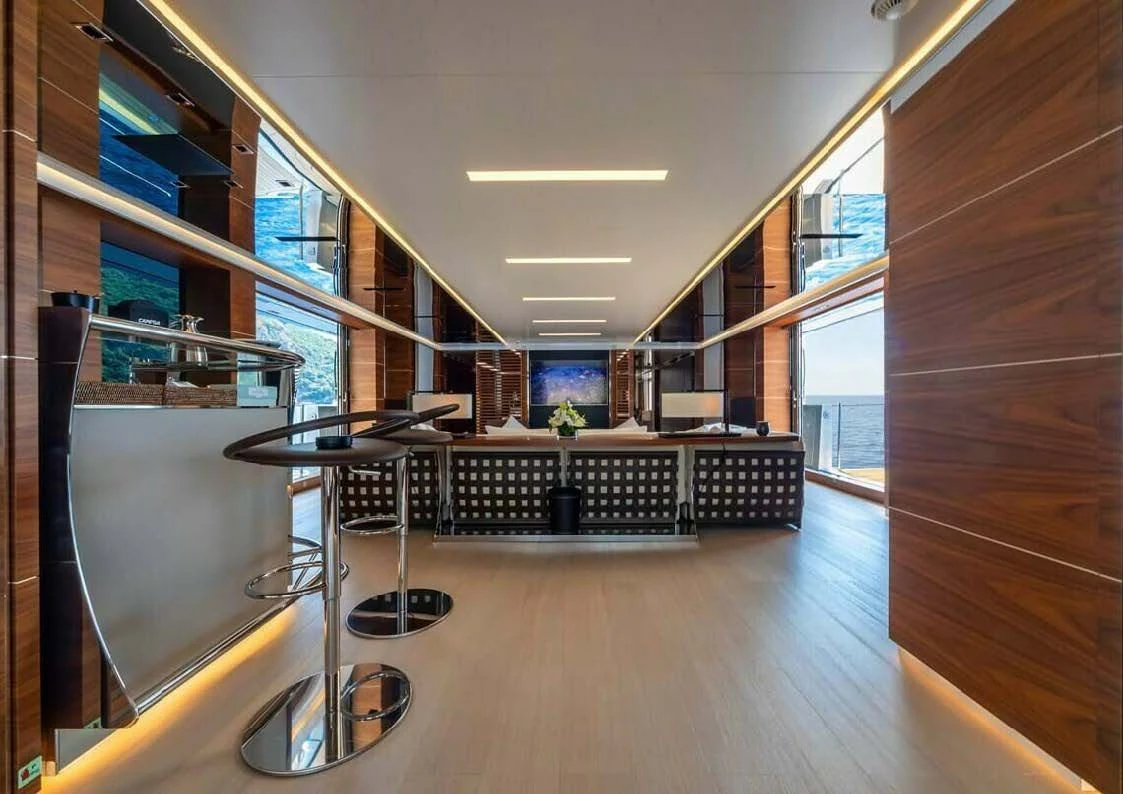 a room with a table and chairs aboard LADY A Yacht for Sale