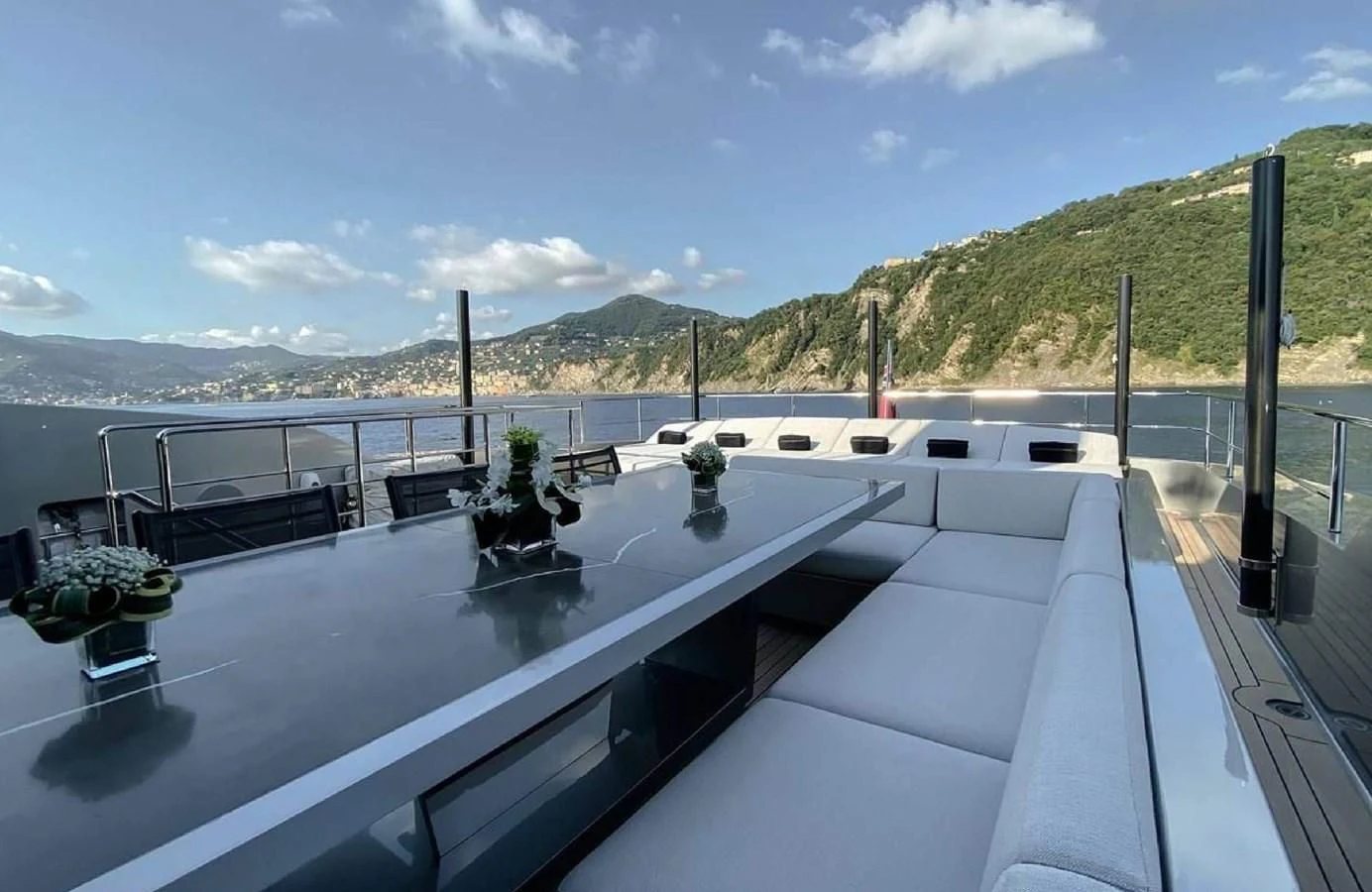 a large white boat on a body of water aboard LADY A Yacht for Sale