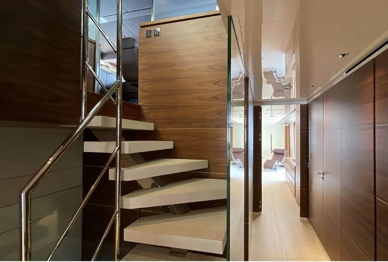 a set of stairs in a house aboard LADY A Yacht for Sale