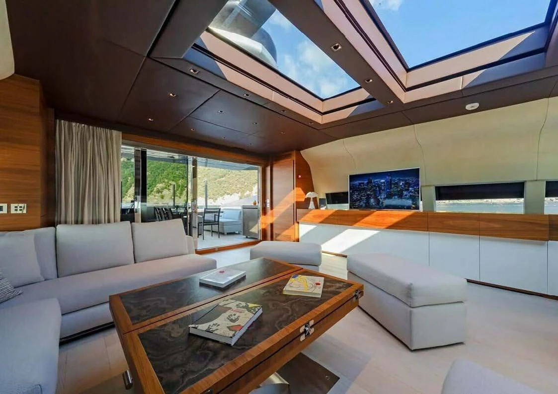 a living room with a large window aboard LADY A Yacht for Sale