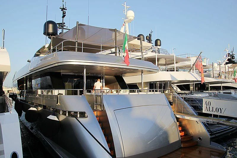 a boat with a flag on the front aboard LADY A Yacht for Sale