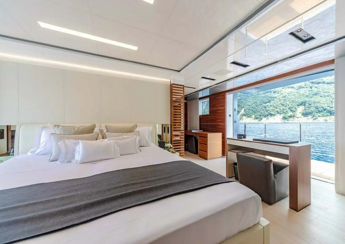 a large bed in a room aboard LADY A Yacht for Sale