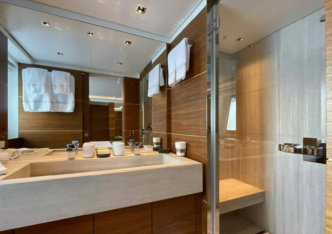 a bathroom with a glass shower aboard LADY A Yacht for Sale