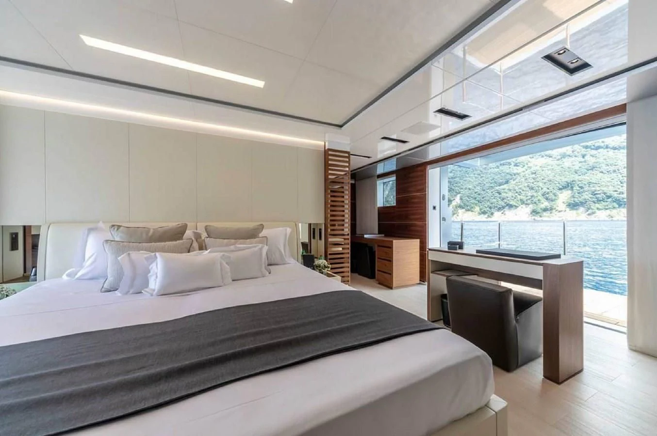 a large bed in a room aboard LADY A Yacht for Sale