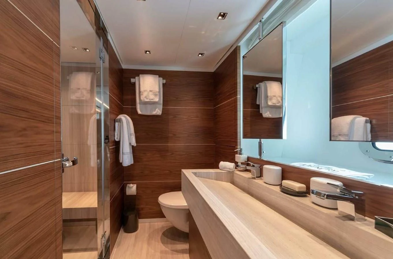a bathroom with a large mirror aboard LADY A Yacht for Sale