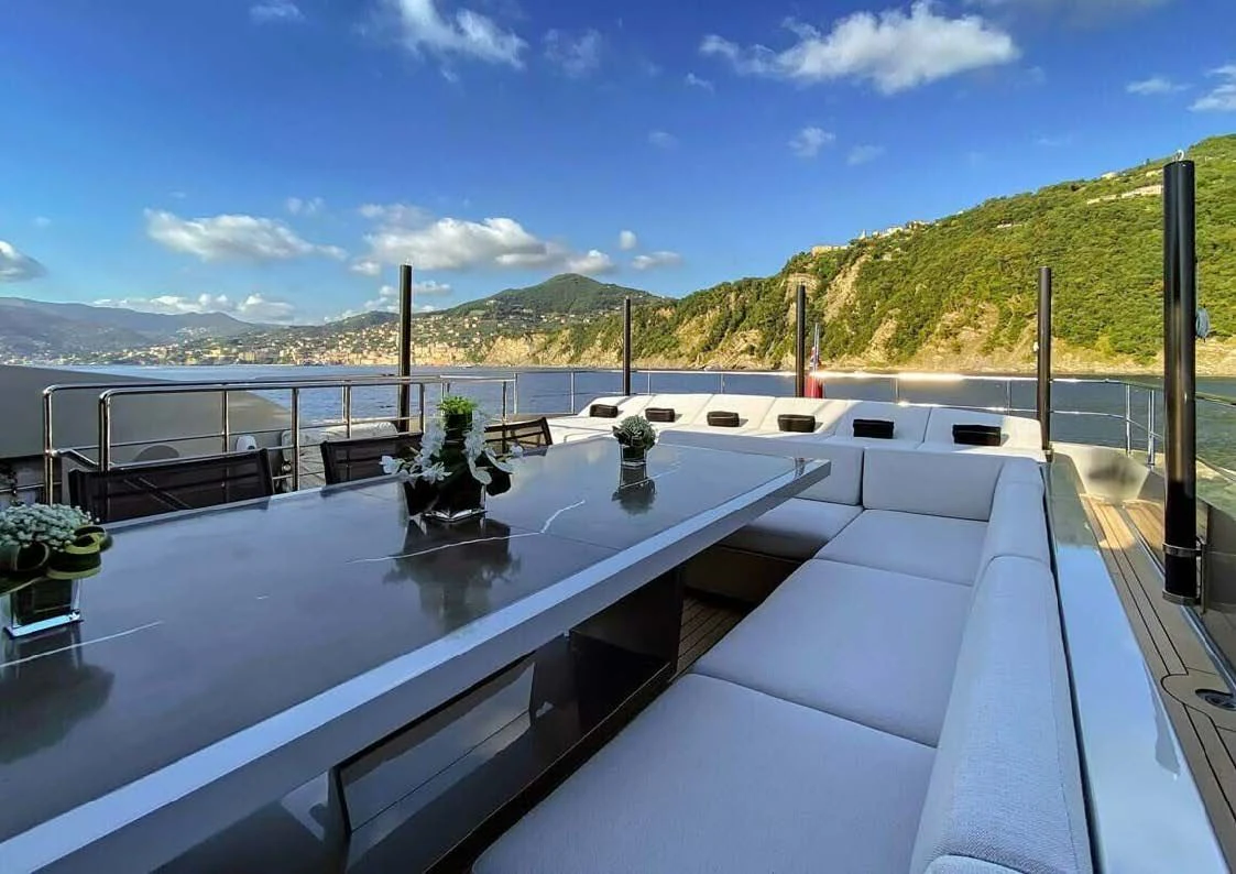 a deck with a large body of water and plants on it aboard LADY A Yacht for Sale