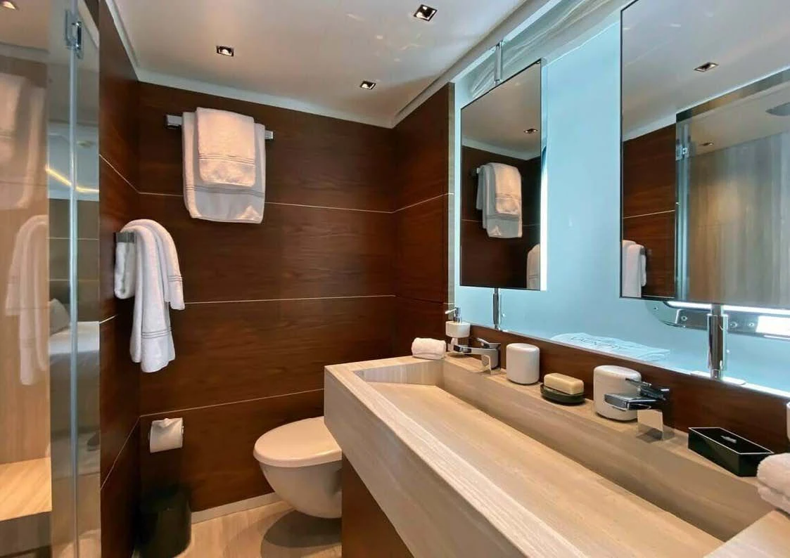 a bathroom with a large mirror aboard LADY A Yacht for Sale