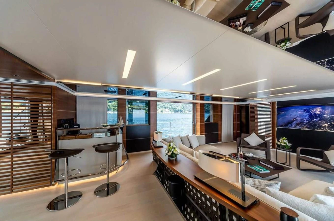 a living room with a large window aboard LADY A Yacht for Sale