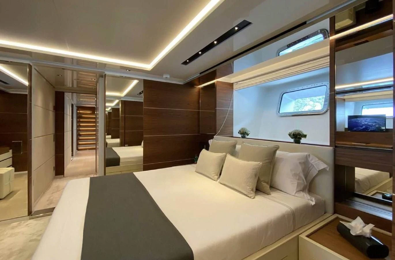 a room with a bed and a window aboard LADY A Yacht for Sale