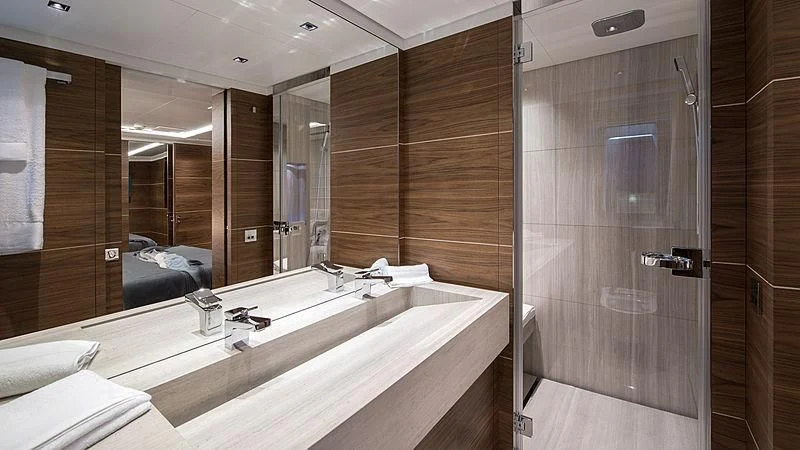 a bathroom with a large mirror aboard LADY A Yacht for Sale