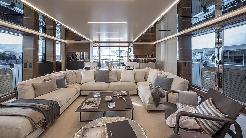 a living room with a couch and a coffee table aboard LADY A Yacht for Sale