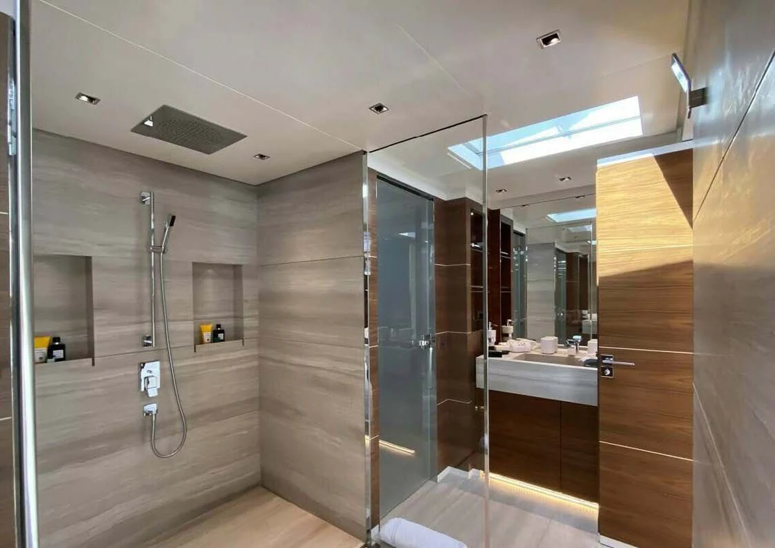 a bathroom with glass walls aboard LADY A Yacht for Sale