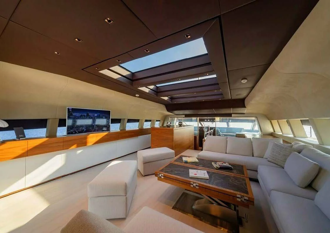a room with couches and a table aboard LADY A Yacht for Sale