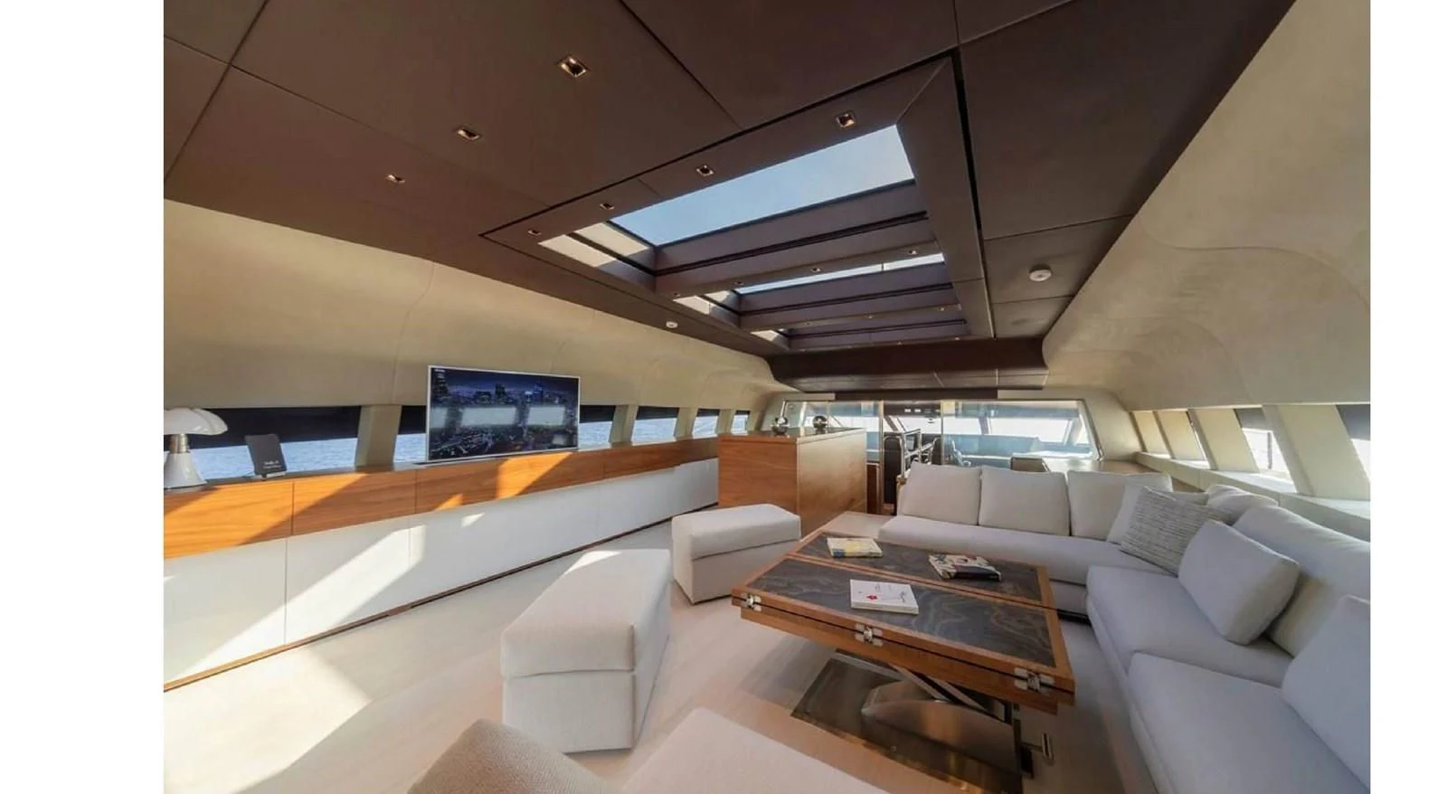 a room with couches and a table aboard LADY A Yacht for Sale