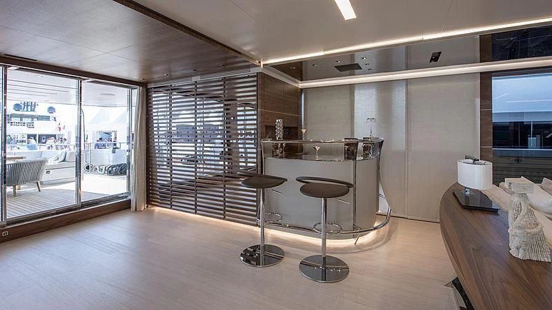 a room with a table and chairs aboard LADY A Yacht for Sale