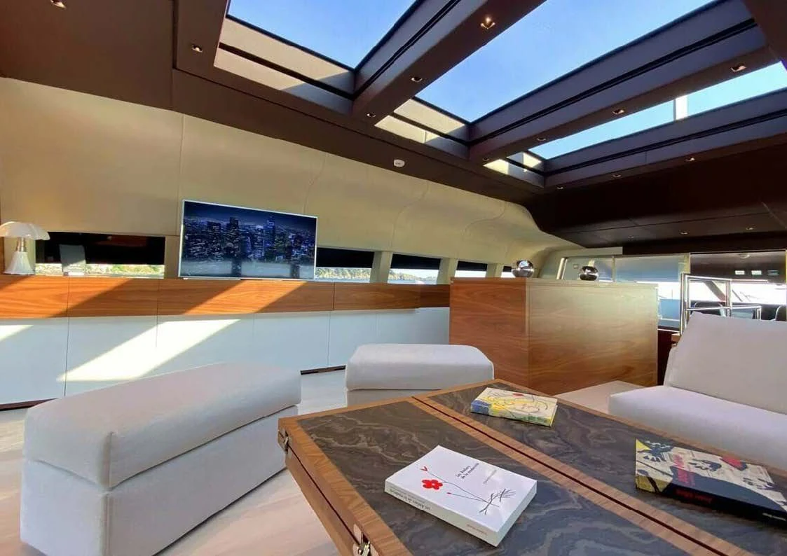 a room with couches and a table aboard LADY A Yacht for Sale