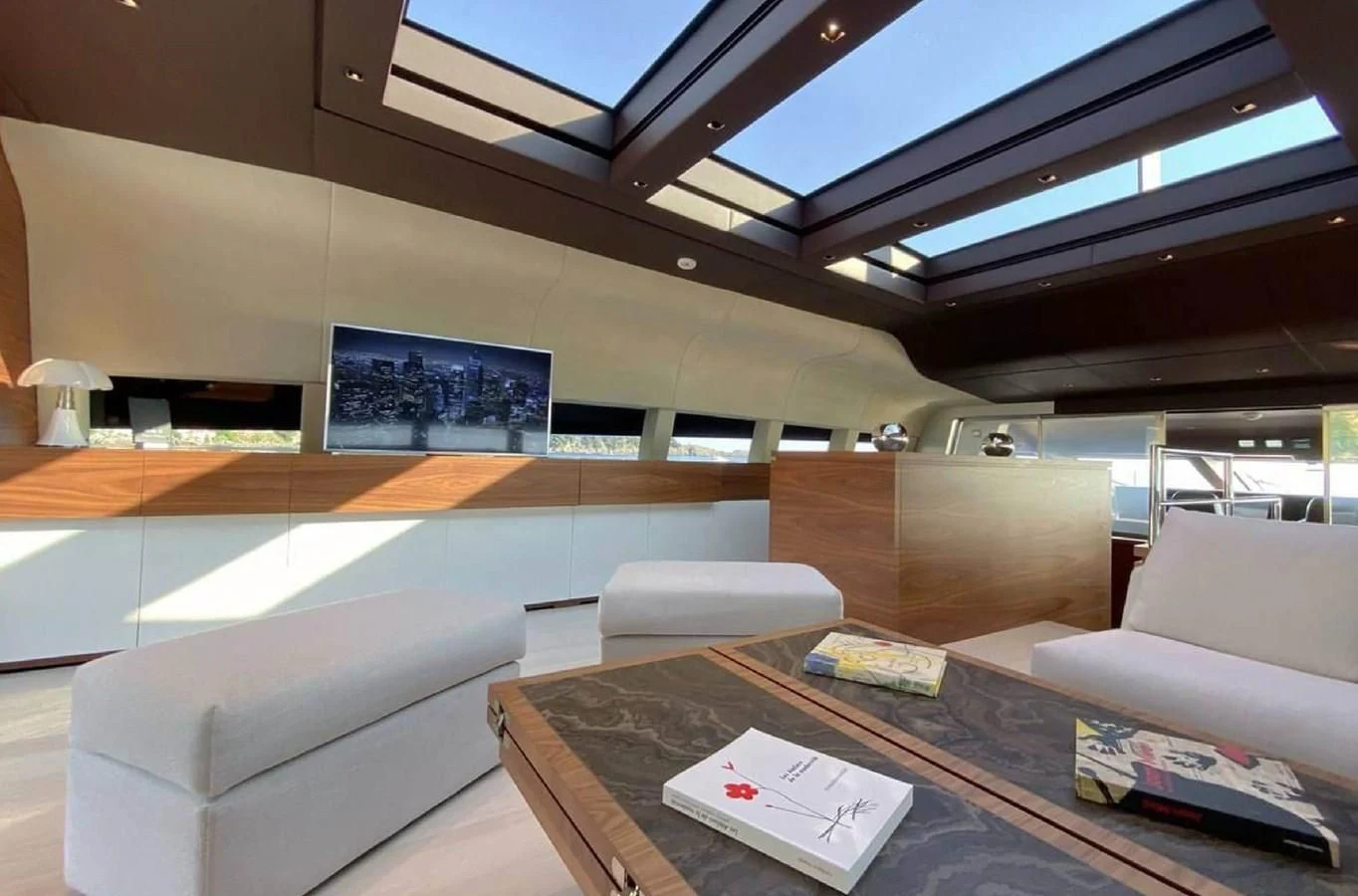 a room with couches and a table aboard LADY A Yacht for Sale