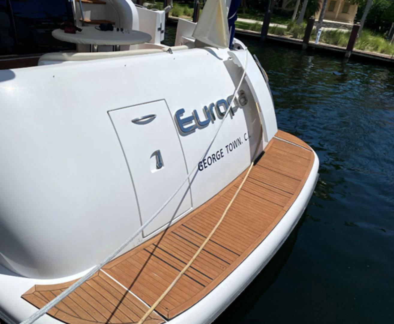 a white boat on a dock aboard EUROPA Yacht for Sale