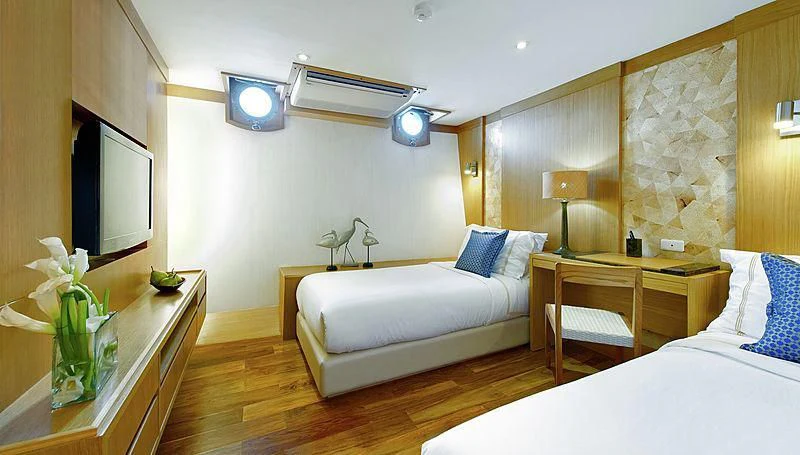 a room with a bed and a desk aboard SALILA Yacht for Sale