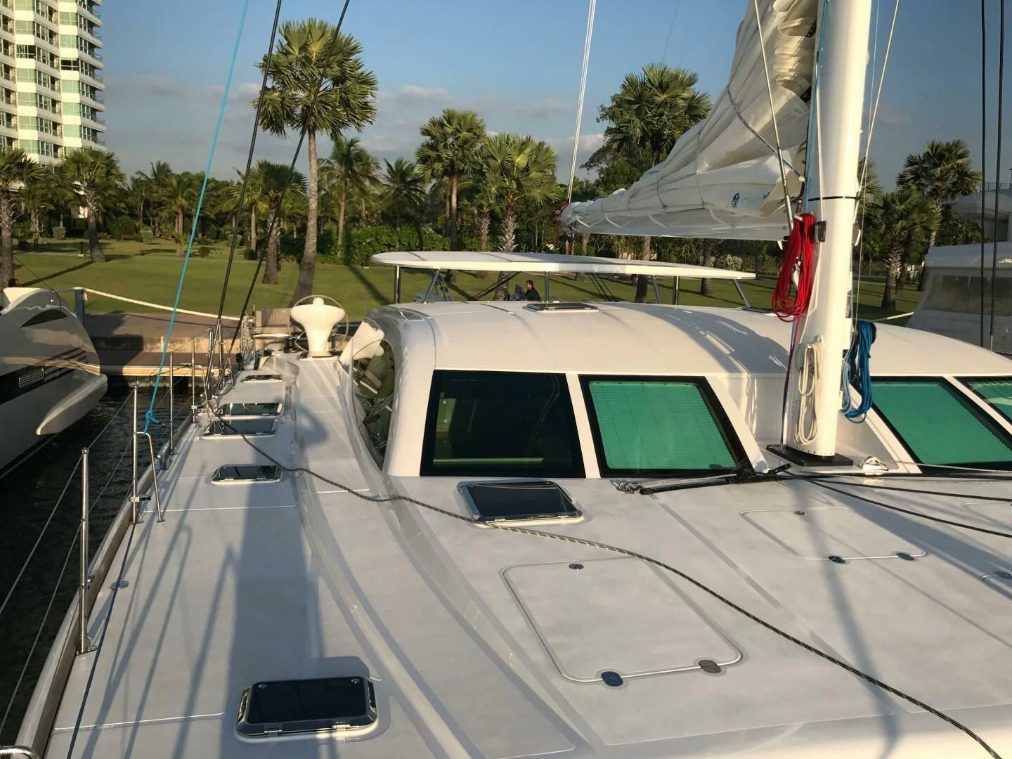 a white and black bus on a road aboard LAYSAN Yacht for Sale