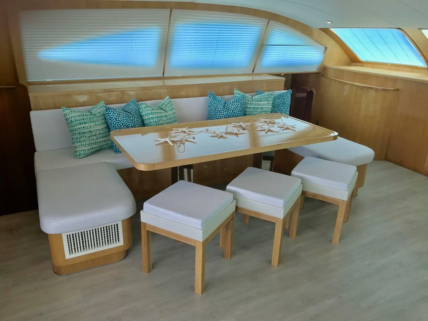 a table with chairs around it aboard LAYSAN Yacht for Sale