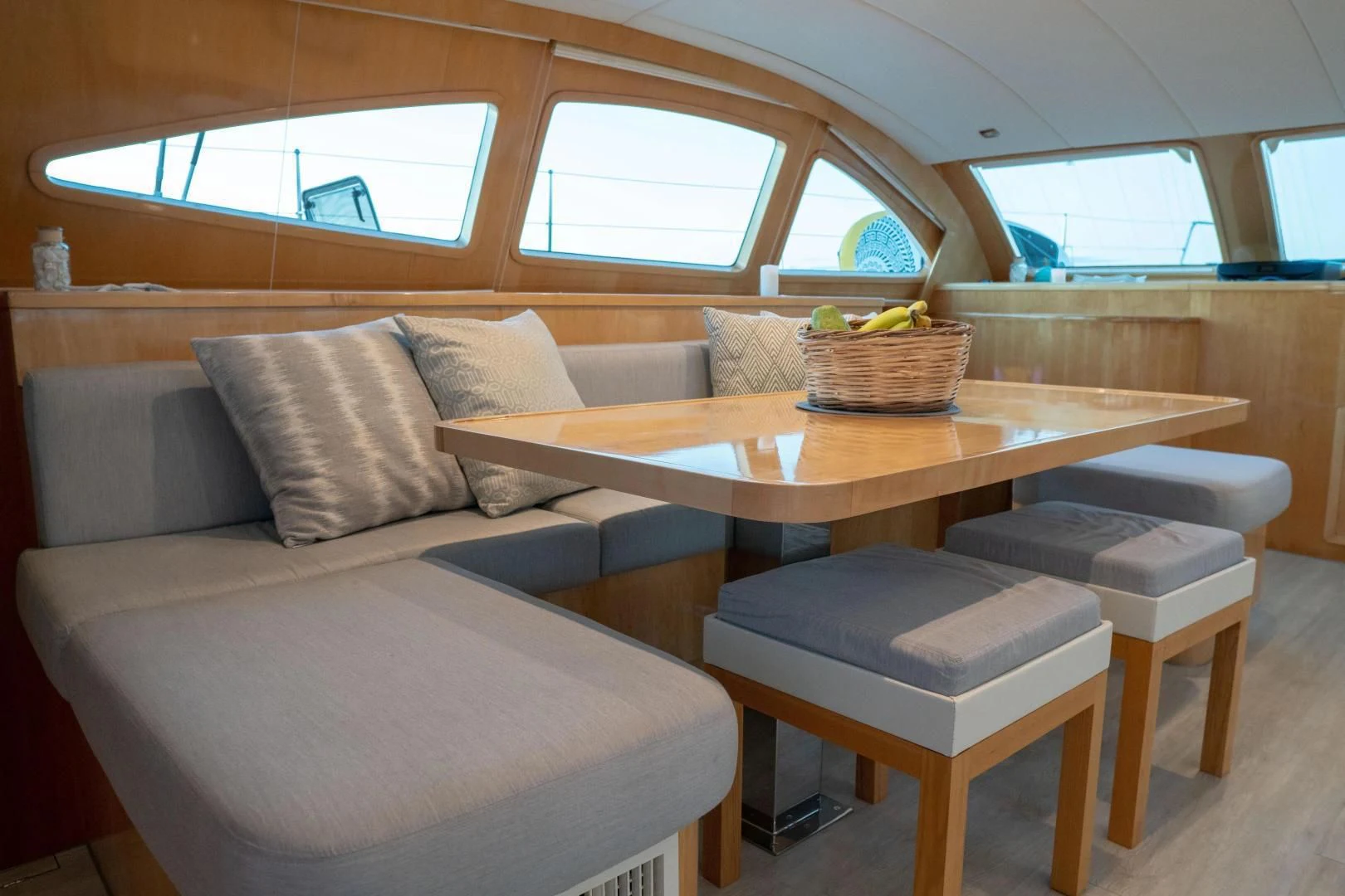 a living room with a couch and a table aboard LAYSAN Yacht for Sale