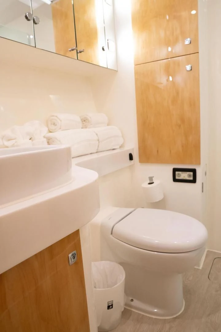 a bathroom with a toilet and sink aboard LAYSAN Yacht for Sale