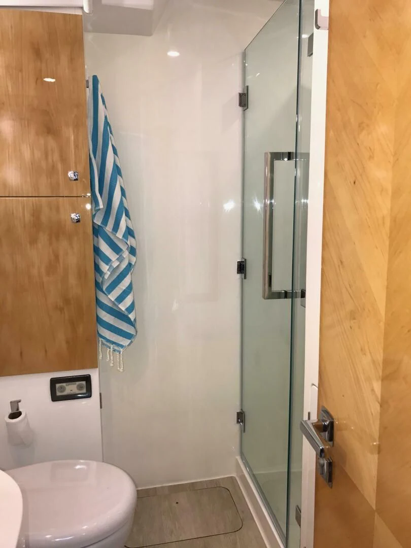 a bathroom with a shower and a sink aboard LAYSAN Yacht for Sale