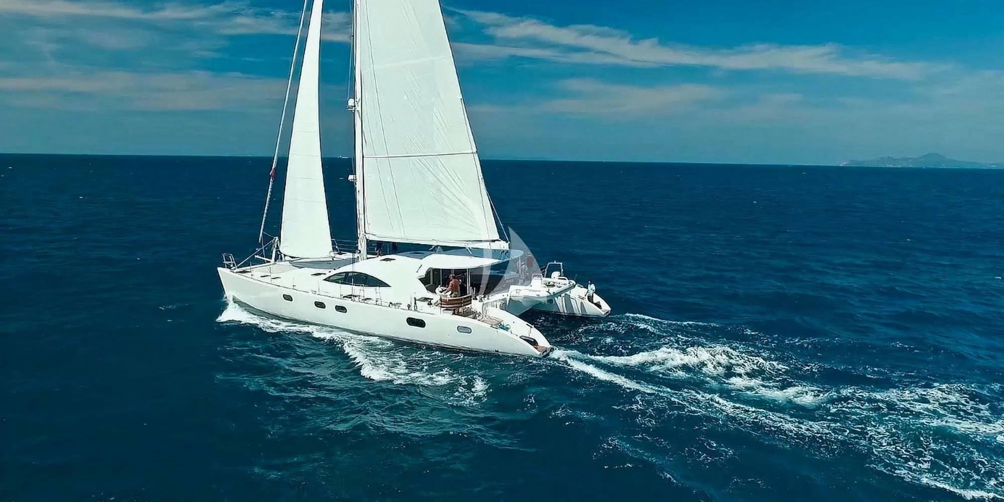 a white boat on the water aboard LAYSAN Yacht for Sale