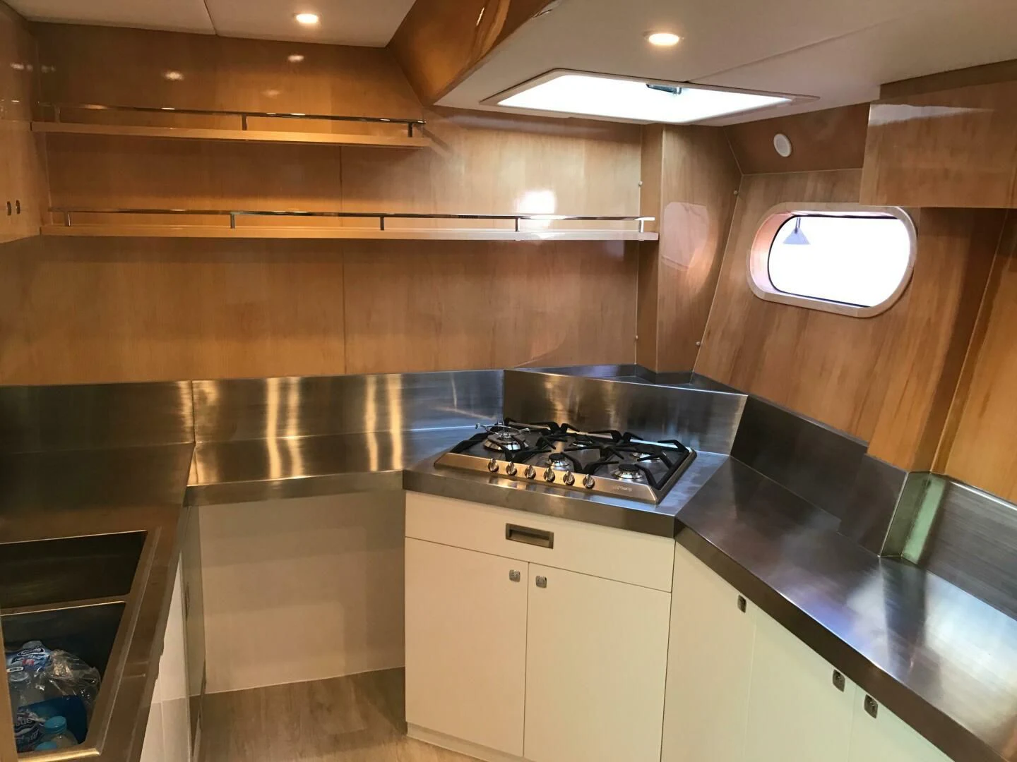 a kitchen with a stove and cabinets aboard LAYSAN Yacht for Sale