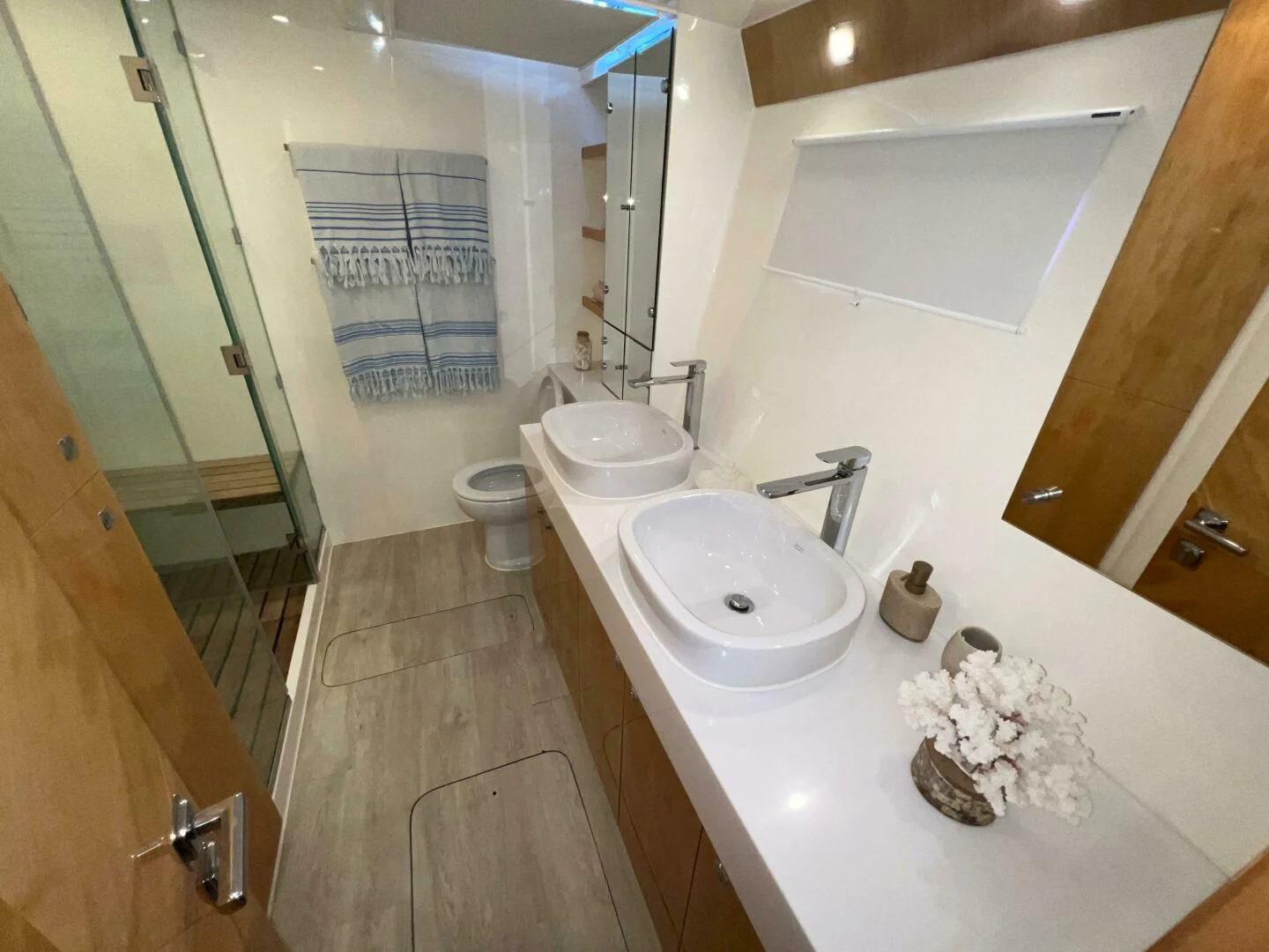 a bathroom with a sink and toilet aboard LAYSAN Yacht for Sale