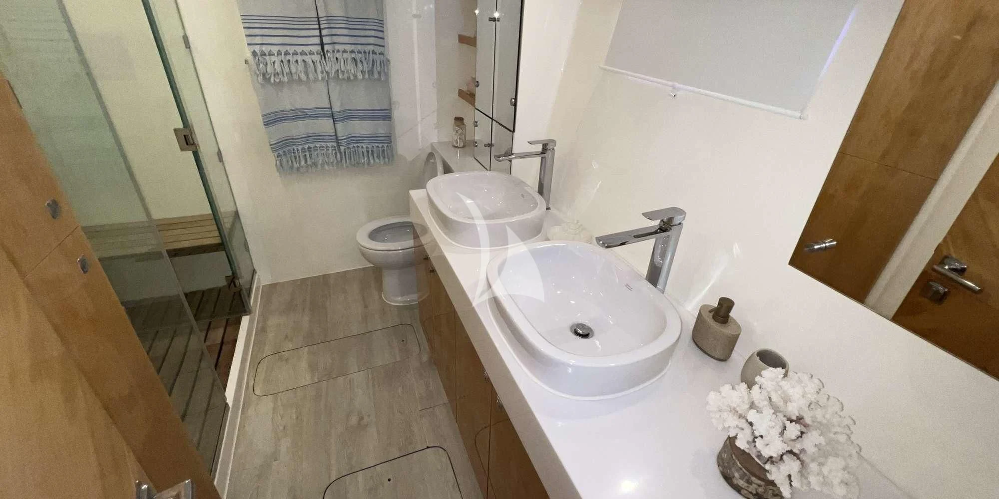 a bathroom with a sink and toilet aboard LAYSAN Yacht for Sale