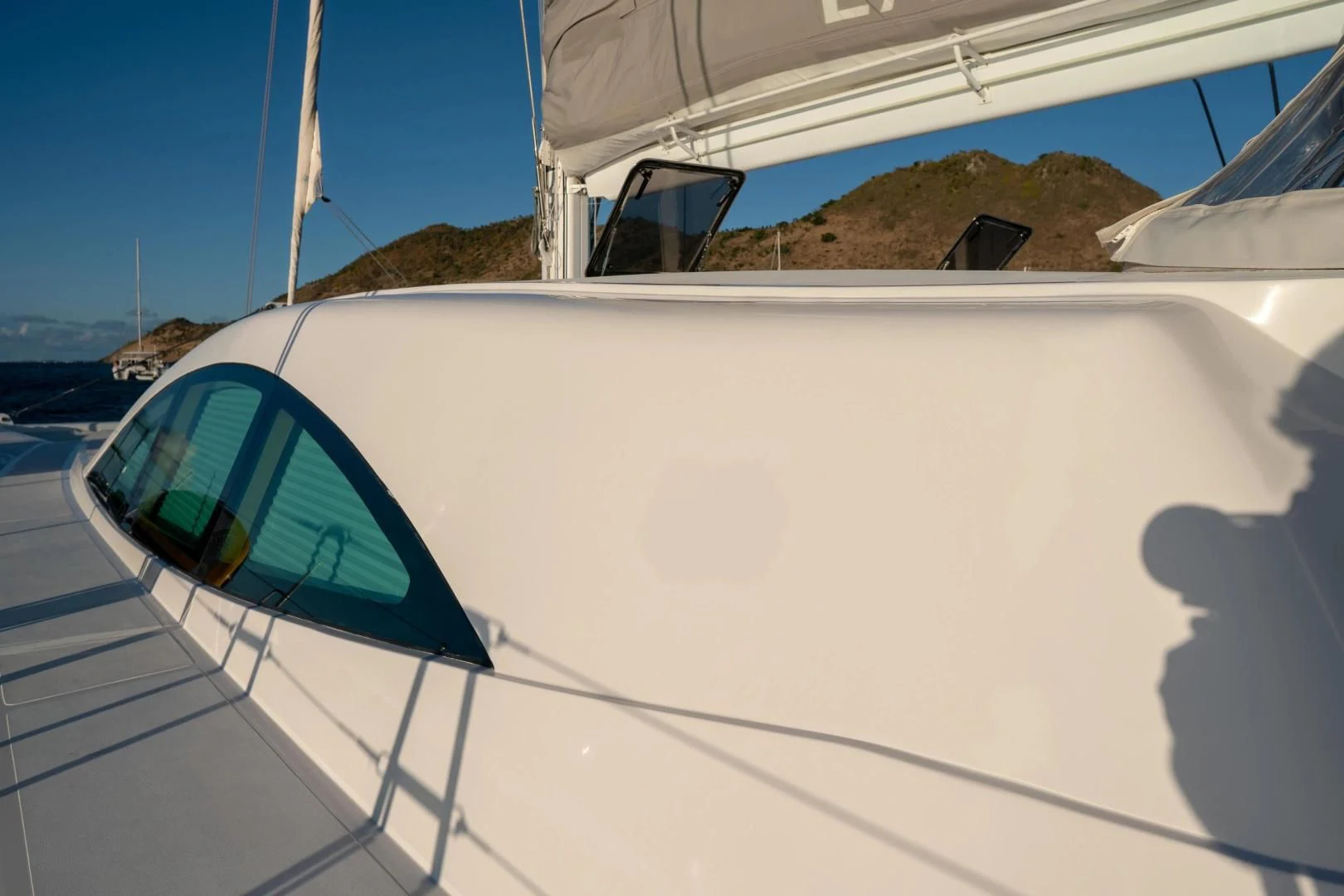 a white car on a beach aboard LAYSAN Yacht for Sale