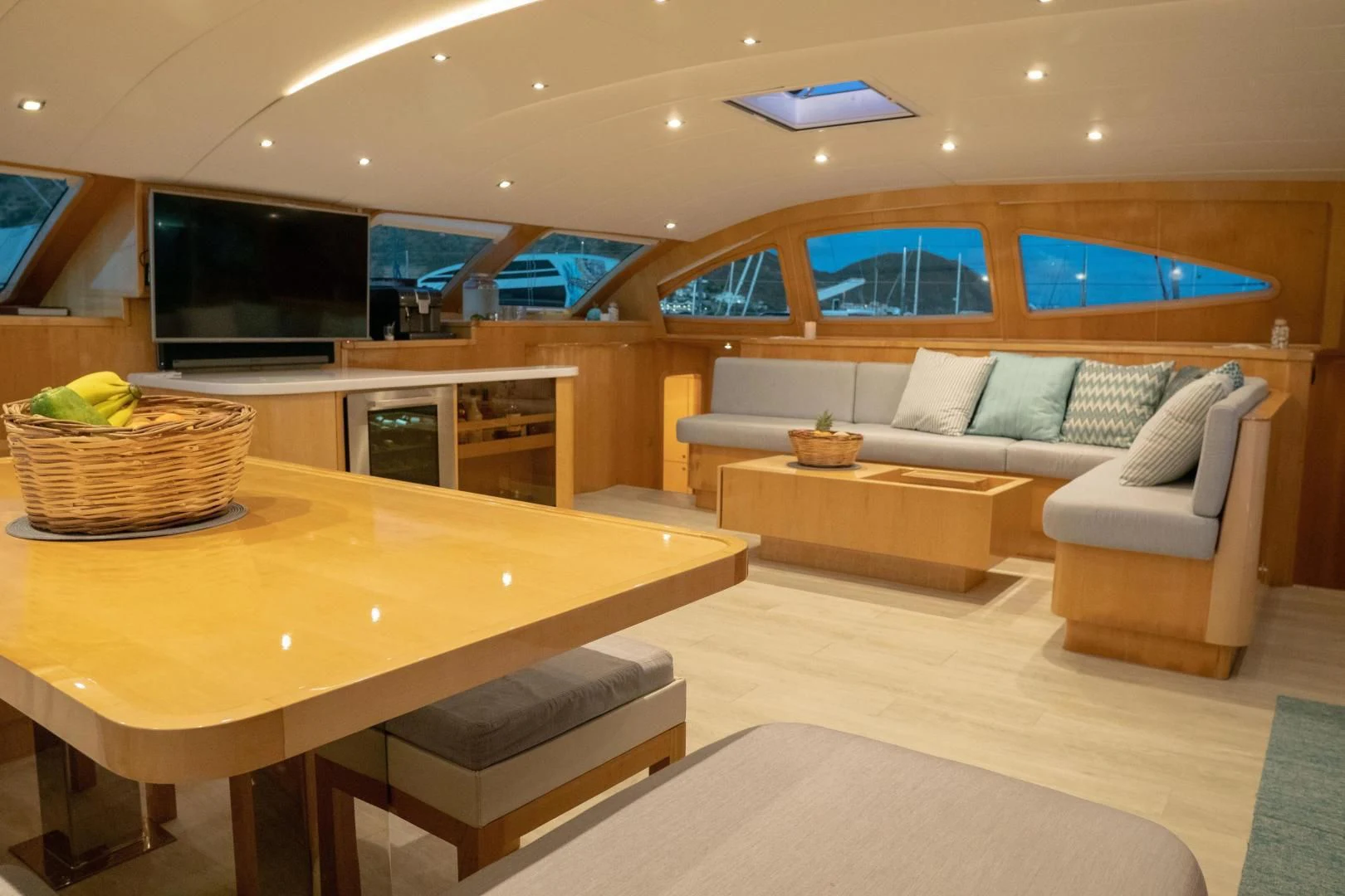 a living room with a couch and a table aboard LAYSAN Yacht for Sale