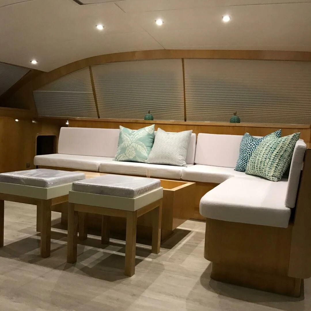 a room with a couch and a table aboard LAYSAN Yacht for Sale