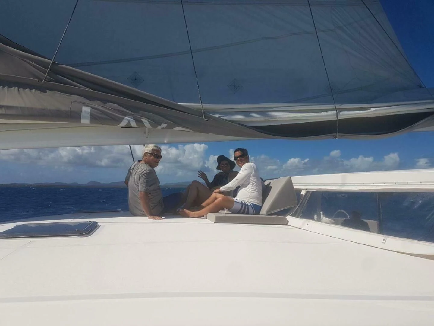 a group of people sitting on a boat aboard LAYSAN Yacht for Sale