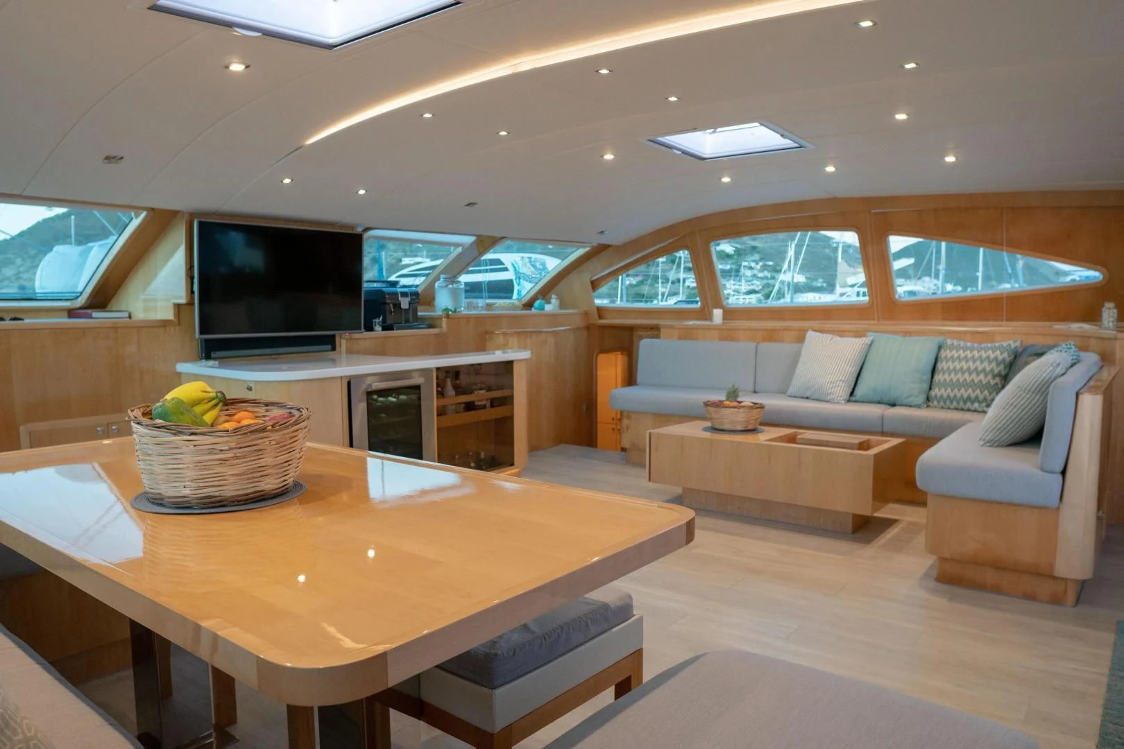 a living room with a couch and a table aboard LAYSAN Yacht for Sale