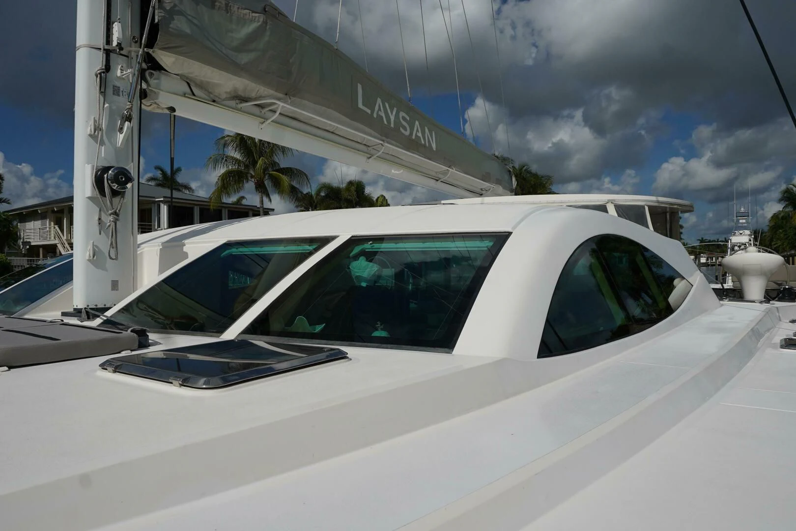 a white car parked on a road aboard LAYSAN Yacht for Sale