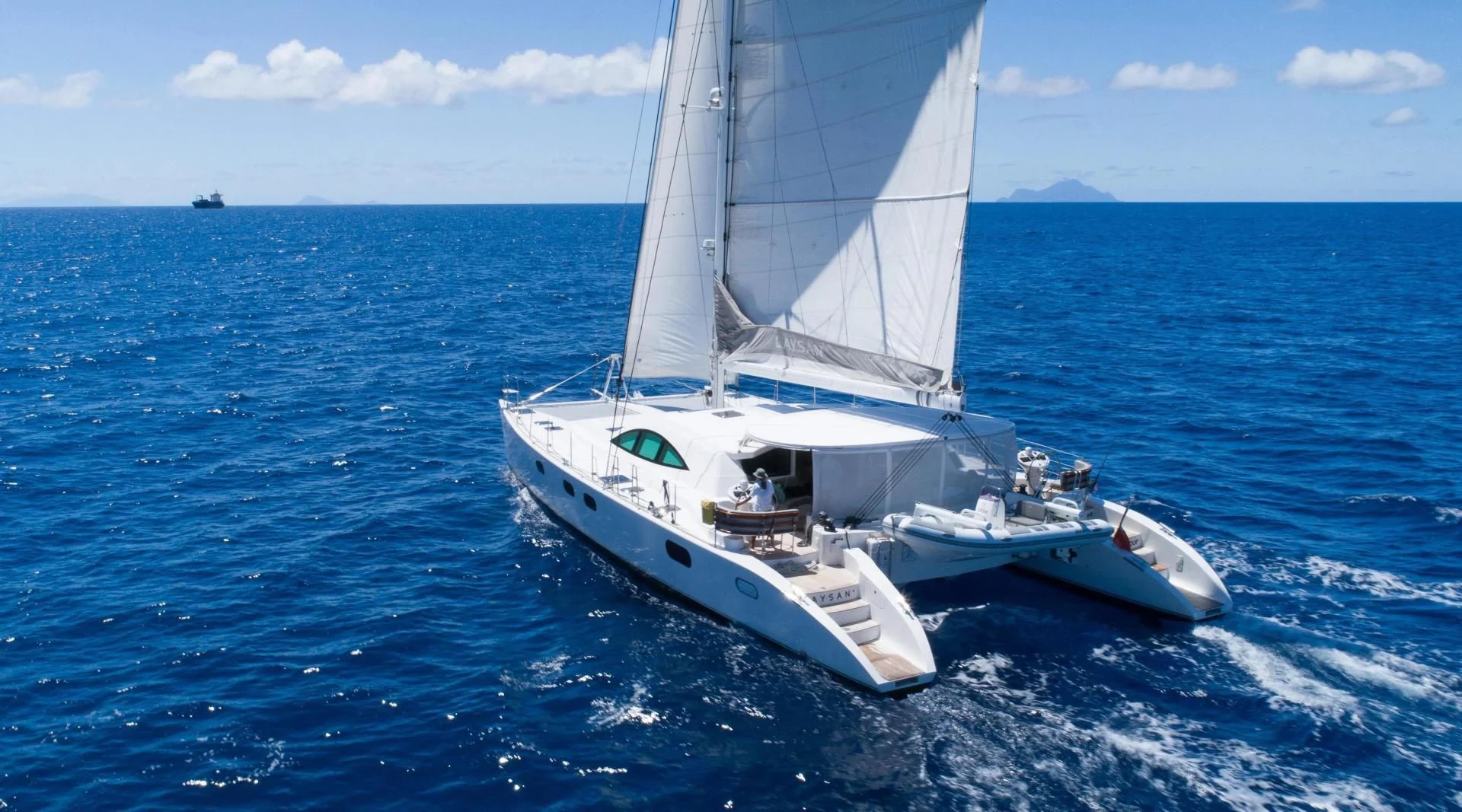 a white boat in the water aboard LAYSAN Yacht for Sale
