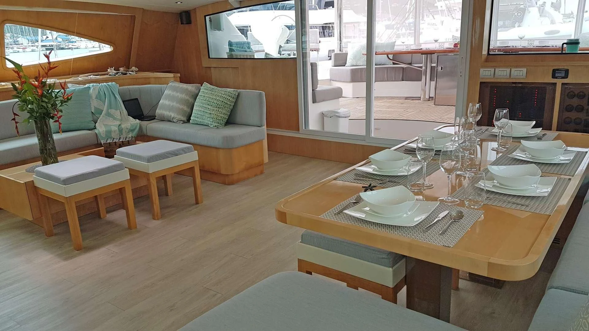 a table with plates and glasses on it aboard LAYSAN Yacht for Sale